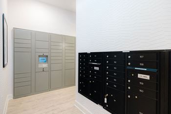 A row of mailboxes are lined up against a wall