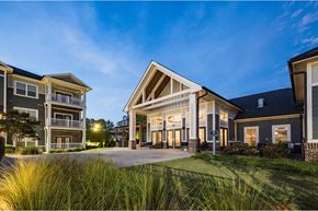 Simpsonville townhouse for rent - A modern house with a spacious front yard and a well-maintained lawn at Waterleaf at Neely Ferry Apartments, Simpsonville, SC 29680