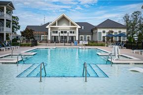 Simpsonville townhouse for rent - A large swimming pool in front of a building at Waterleaf at Neely Ferry Apartments, South Carolina