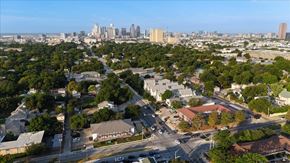Dallas apartment for rent - A cityscape with a mix of residential and commercial buildings.