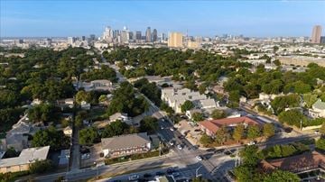 Dallas apartment for rent - A cityscape with a mix of residential and commercial buildings.
