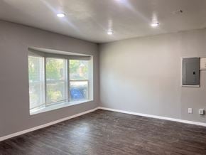 Dallas apartment for rent - A room with a window and a wall-mounted electrical panel.