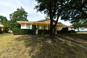 Duncanville apartment for rent - A house with a tree in front of it.