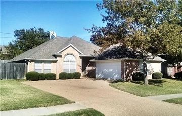 Arlington condo for rent - A house with a brown roof and a white garage door.