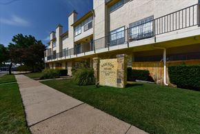 Dallas condo for rent - A building with a sign that says Ashford Square.