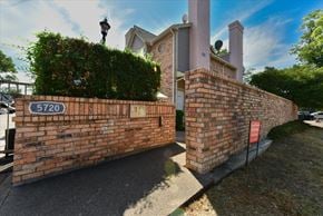 Dallas apartment for rent - A brick wall with a sign that reads 5720.