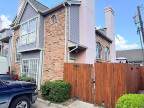 Dallas apartment for rent - A blue truck is parked in front of a house.