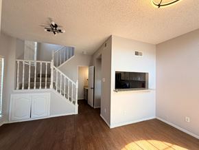 Dallas apartment for rent - A room with a staircase and a flat screen TV.
