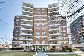 Toronto apartment for rent - A large apartment building with a lot of windows and balconies.