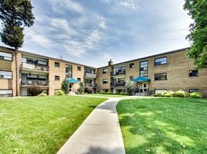 Toronto apartment for rent - A grassy area in front of apartment buildings.
