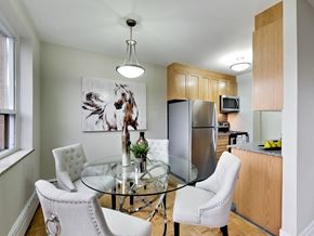Toronto apartment for rent - a kitchen and dining room with a glass table and chairs