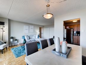 Mississauga apartment for rent - a living room and dining room with a table and chairs