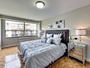 Toronto apartment for rent - a bedroom with a large bed and a window