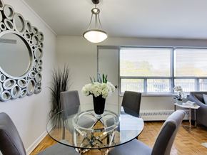 Toronto apartment for rent - a dining room with a glass table and chairs