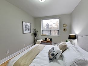 Toronto apartment for rent - a bedroom with a large bed and a window