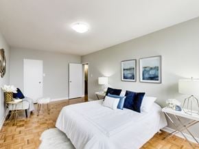 Toronto apartment for rent - a patient room with two beds and a sign on the wall