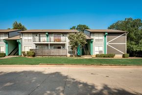 Dallas apartment for rent - an exterior view of an apartment building on the side of a street