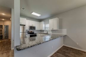 Springtown apartment for rent - an empty kitchen with a granite counter top