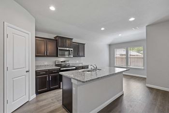 Fully equipped gourmet kitchens w/ granite counter