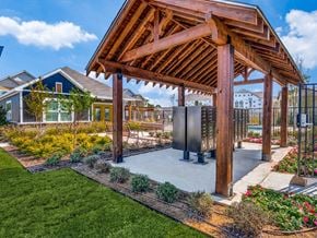 Fort Worth apartment for rent - a gazebo with a hot tub in a garden