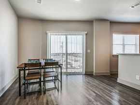 Richardson apartment for rent - a dining room with a table and chairs and a window