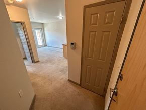 Kingston apartment for rent - A brown door is on the right side of the image.