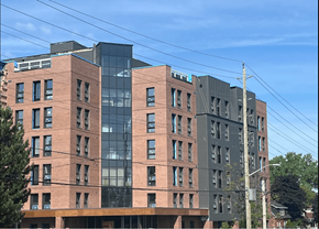 Kingston apartment for rent - a city building with a blue sky in the background
