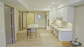 Kingston apartment for rent - A kitchen with a table and chairs in the middle of the room.