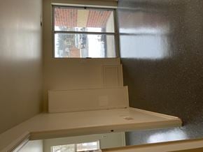 Kingston apartment for rent - A white desk with a window above it.
