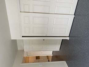 Kingston apartment for rent - A white cabinet with a mirror above a wooden table.