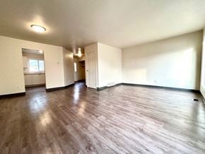 Kingston townhouse for rent - an empty living room with a hard wood floor