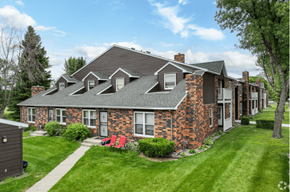 Grand Forks apartment for rent - A house with a red chair in front of it.