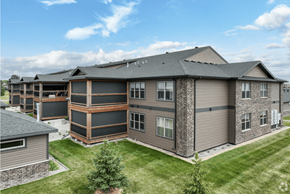 Grand Forks apartment for rent - an aerial view of an apartment building with brown and black siding