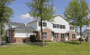 Grand Forks apartment for rent - a white house with a yard and trees