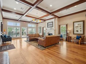 Raleigh apartment for rent - A living room with a fireplace and a couch.