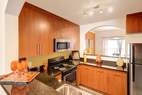 Newport News apartment for rent - Kitchen with black granite countertops; opening to separate dining room