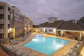 Raleigh apartment for rent - a resort style pool with lounge chairs