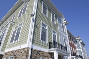 Buffalo apartment for rent - A multi-story building with a balcony on the second floor.