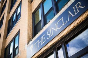 Buffalo apartment for rent - The Sinclair sign is mounted on a brick building.