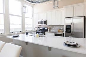 Buffalo apartment for rent - A kitchen with white cabinets and a white countertop.