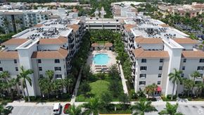 Boynton Beach apartment for rent - A large apartment complex with a pool in the middle.