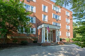 Shaker Heights apartment for rent - the front of a brick building with an flag on the side