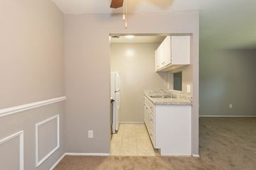 Rocky River apartment for rent - a kitchen with white cabinets and a white refrigerator