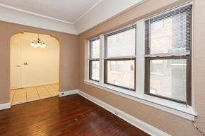 Cleveland Heights apartment for rent - a living room with three windows and a hard wood floor