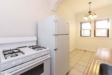Cleveland Heights apartment for rent - a kitchen with a stove and a refrigerator