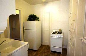 Lakewood apartment for rent - a kitchen with a refrigerator and a stove and a sink