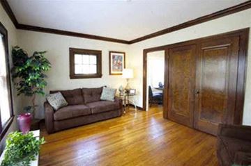 Lakewood apartment for rent - a living room with a couch and a wooden floor