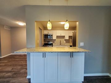 Rocky River apartment for rent - a kitchen with an island with a granite counter top
