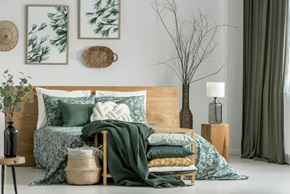 Washington apartment for rent - A bedroom with a bed, pillows, blankets, and decorative items.