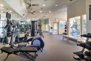 Dallas townhouse for rent - The 24-hour fitness center with treadmills, elliptical machines, and free weights at The Brownstones Townhome Apartments in the Far North Dallas neighborhood of Dallas, TX..
